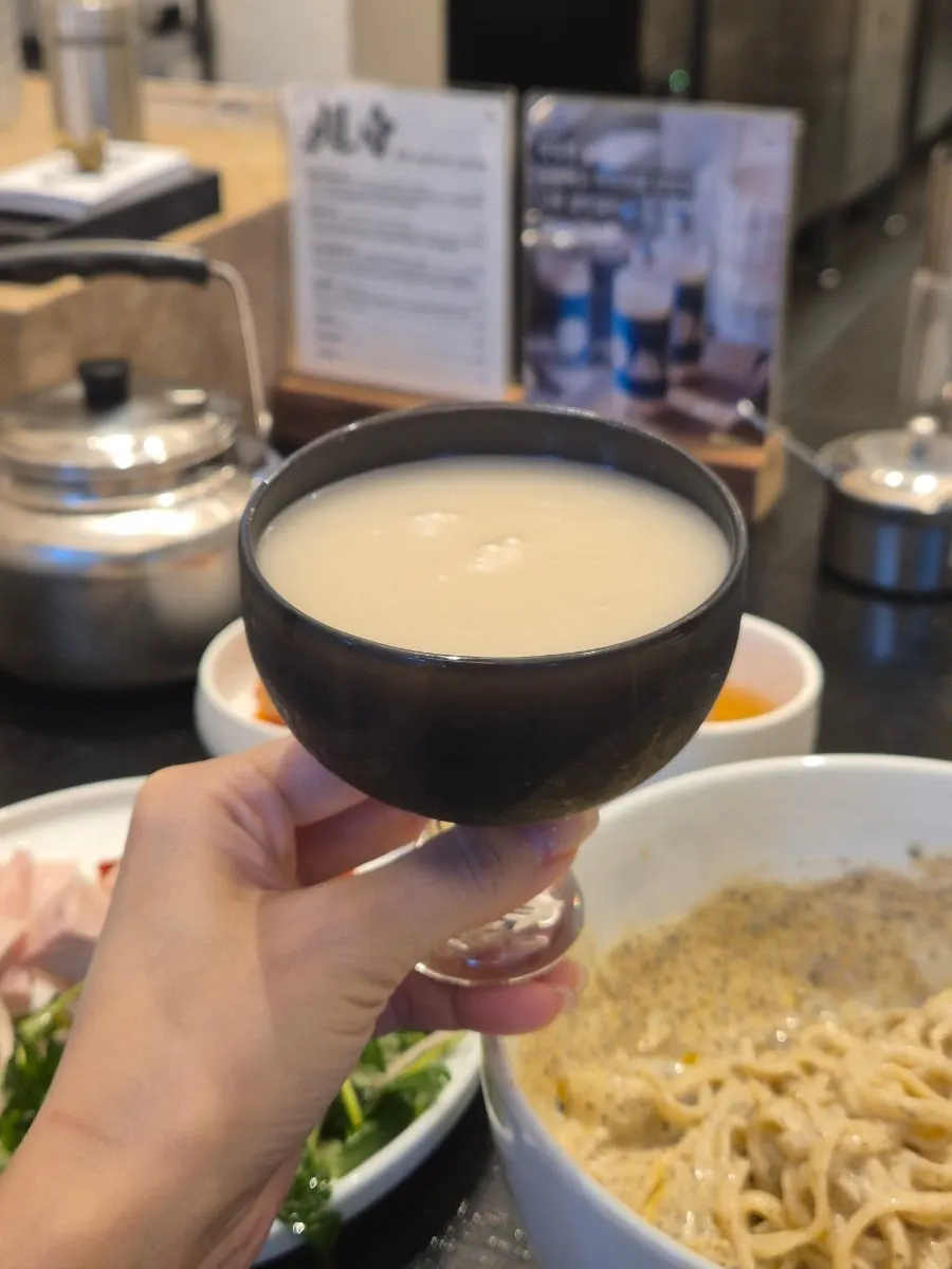 Enjoying cold soy mixed kalguksu