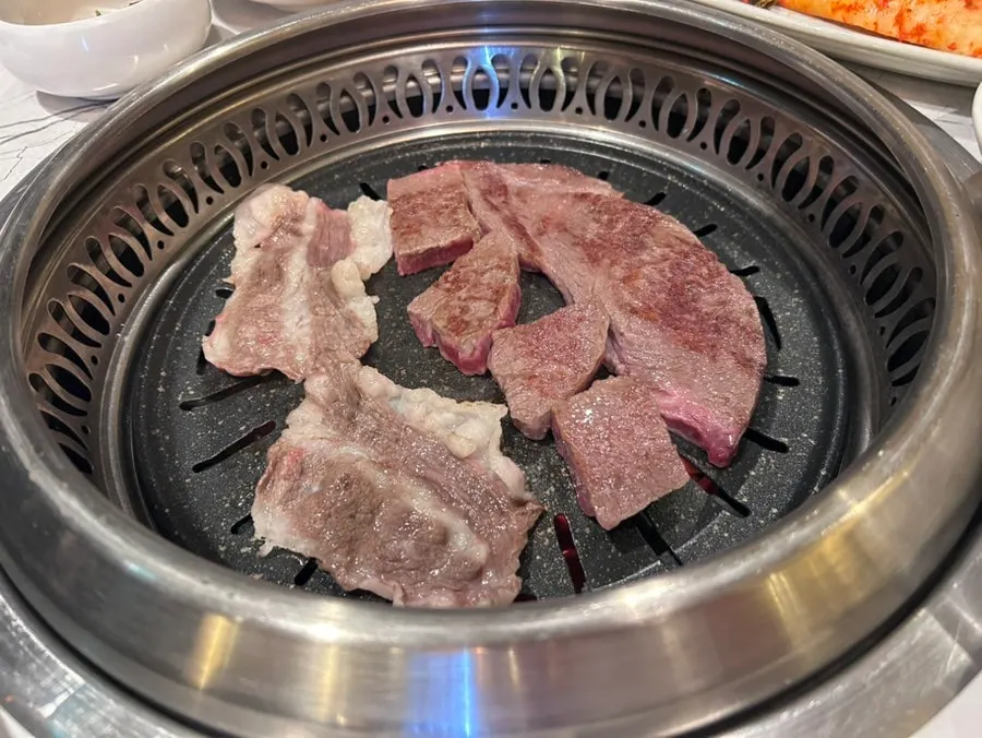 Close-up of hanwoo rib eye cooking