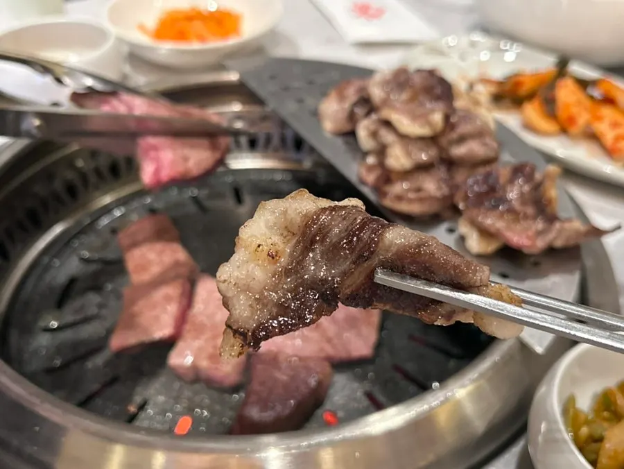 Picking up a piece of grilled rib eye