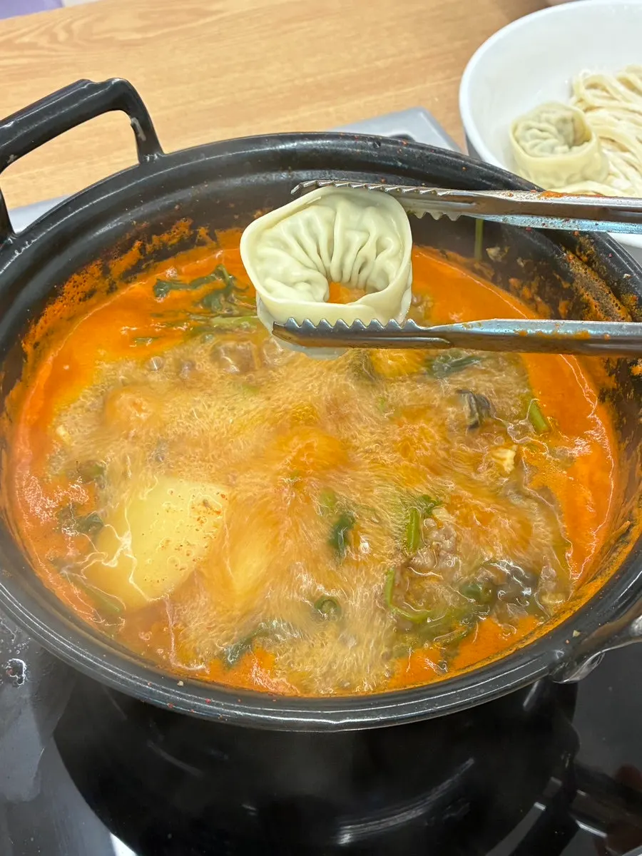 Plate of shabu-shabu with mushrooms and vegetables