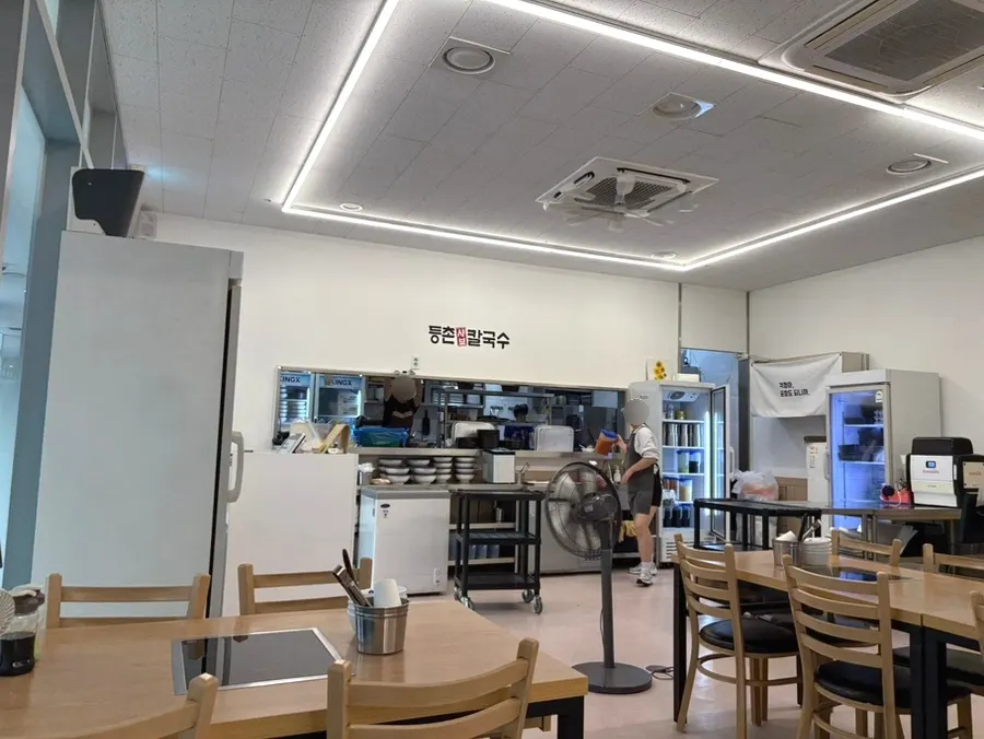 Interior seating near the entrance of Deungchon Shabu Kalguksu Giheung Station Branch