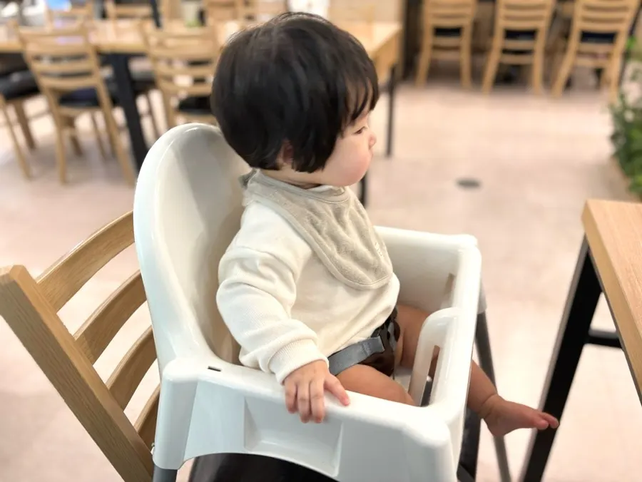 Baby chair set up on top of a regular chair