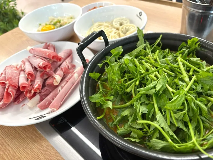 Spread of spicy mushroom shabu kalguksu set for two