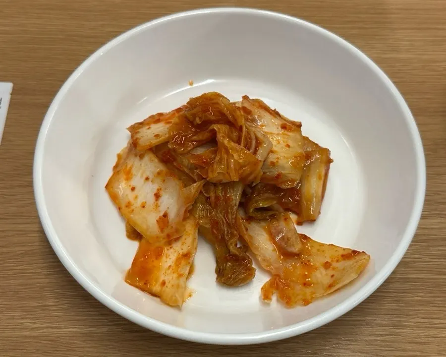 Kalguksu noodles dropped into the spicy broth