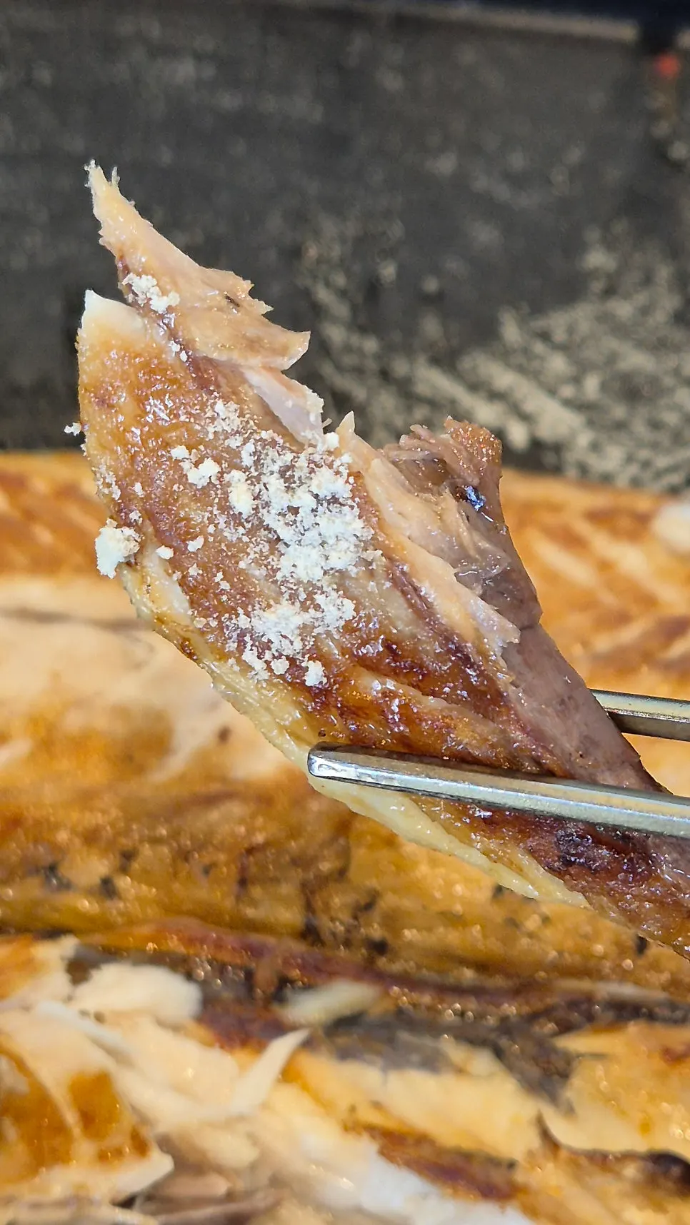 A piece of mackerel dipped in nuruk salt