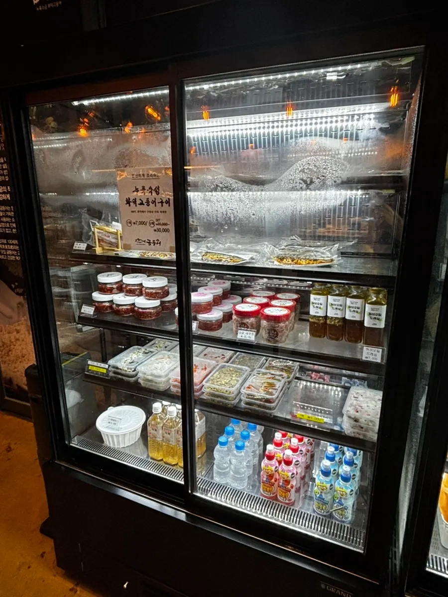Store corner displaying packaged side dishes for takeout