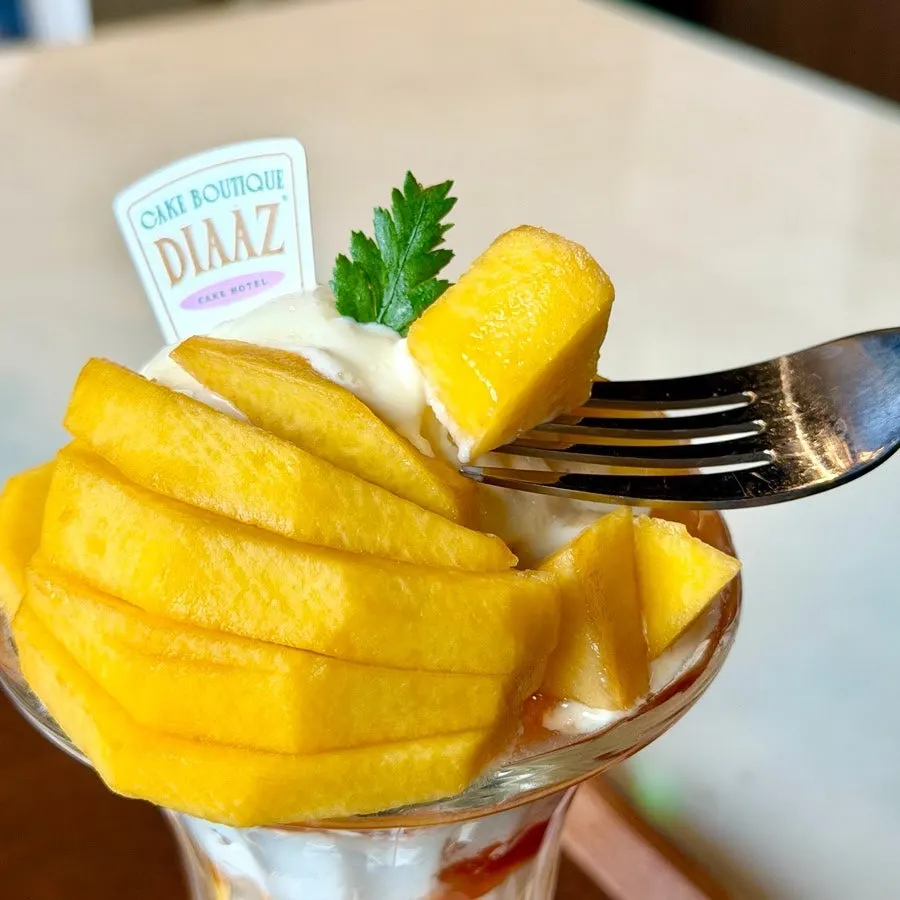 Peach pieces scooped from the peach parfait