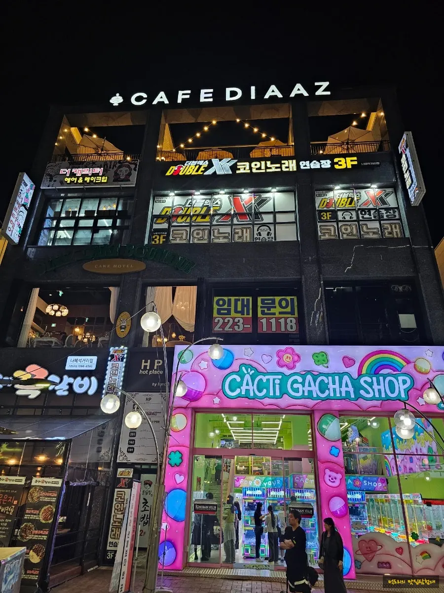 Building entrance with signage for the 2nd-floor Cake Boutique and 4th-floor café
