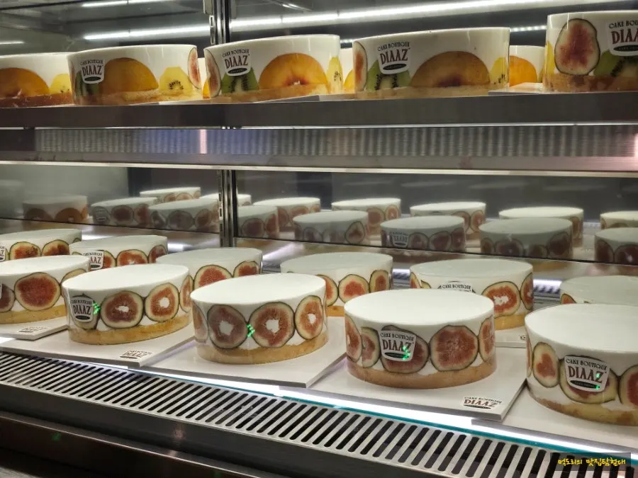 Interior of the shop with cakes and specialty menu items displayed