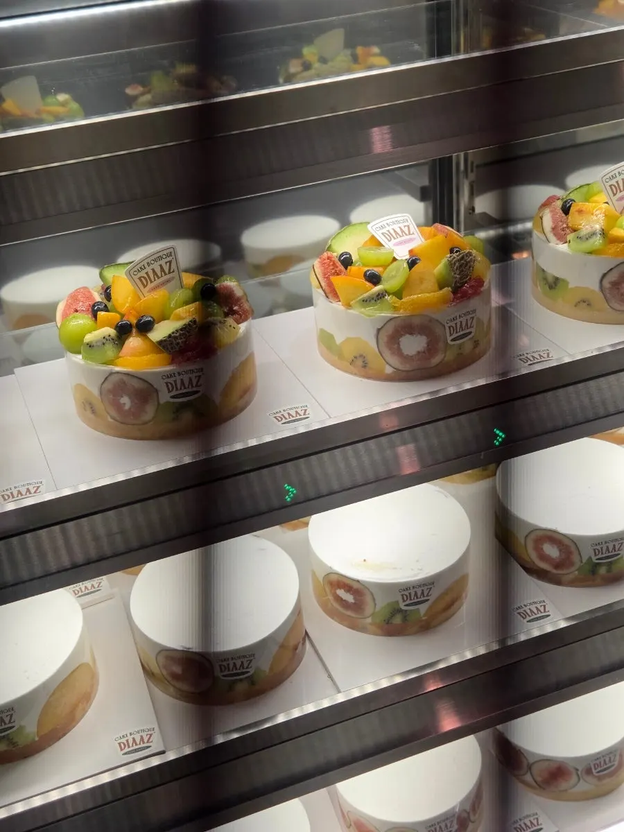Display case filled with seasonal fruit cakes