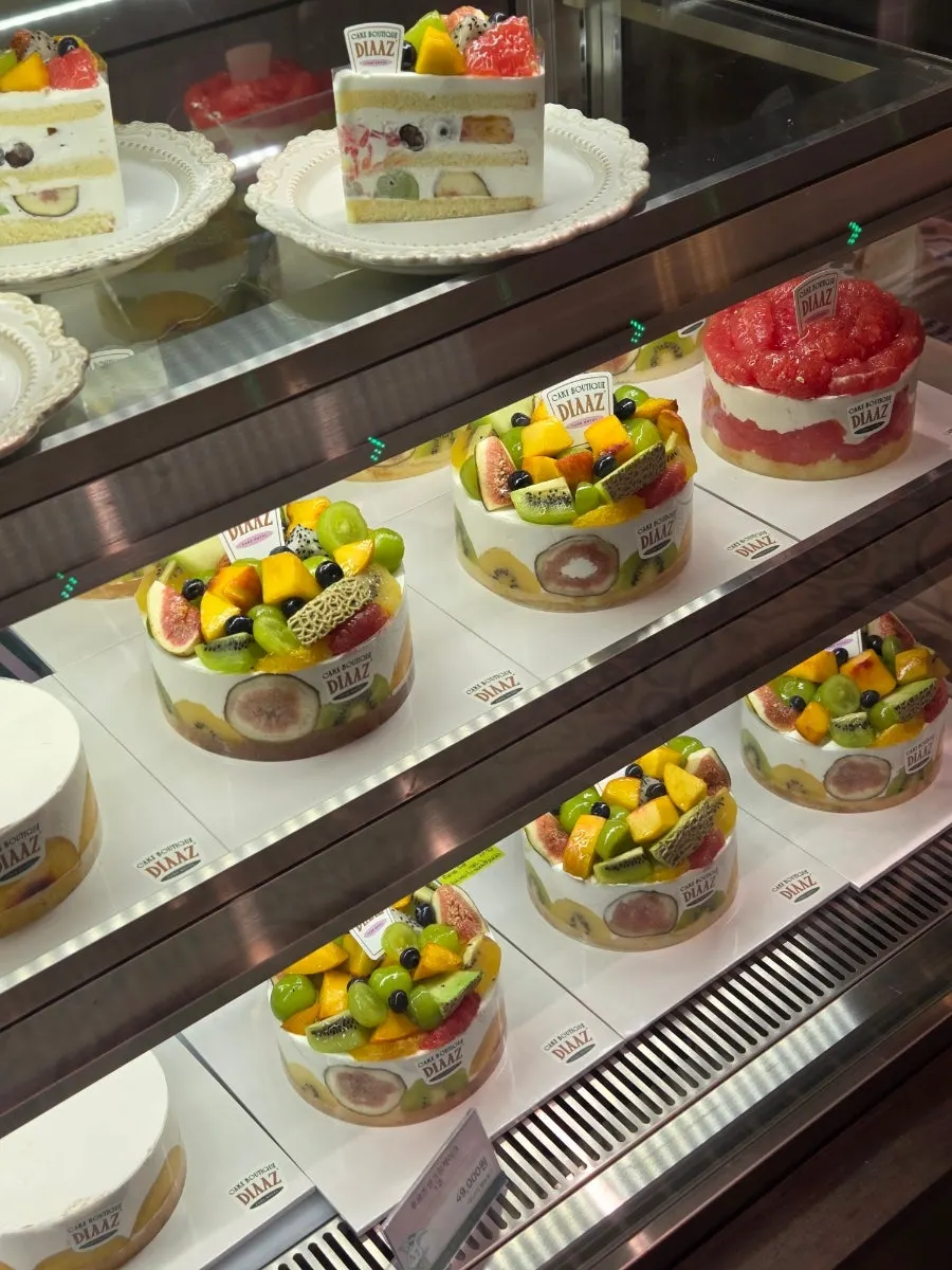Display case of cakes made with dairy fresh cream