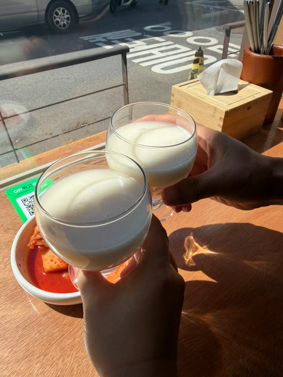 Neurin Maeul makgeolli poured into a glass by the window