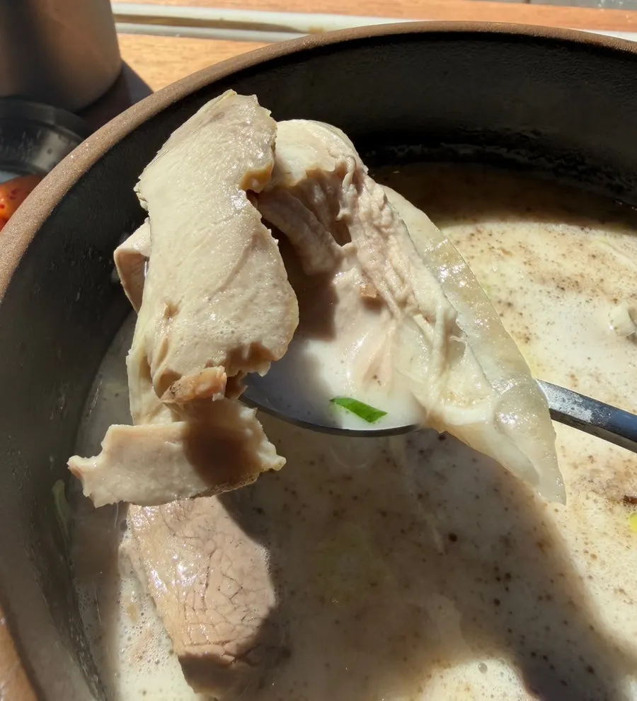 Tangy fermented kimchi served alongside the gomtang