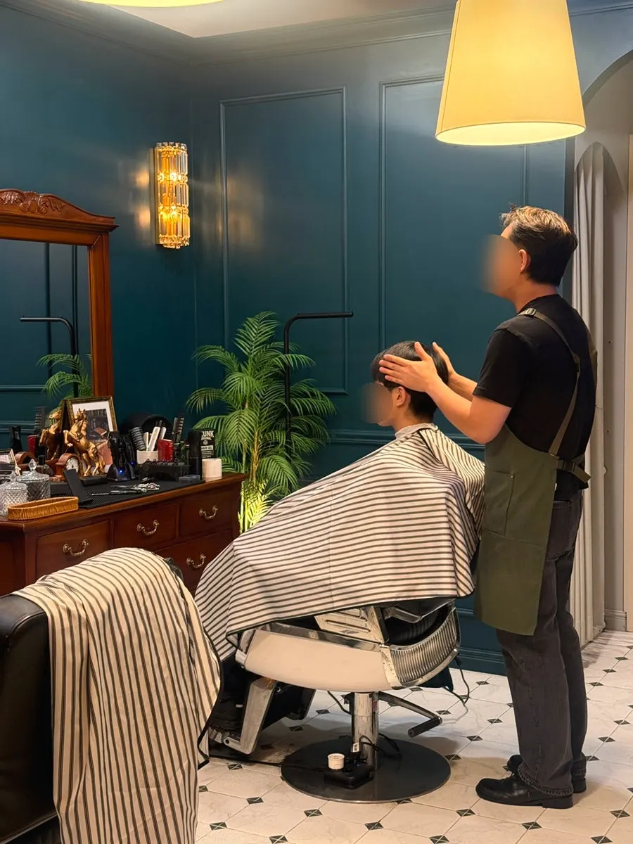 Consultation before the cut, checking head shape and hair condition