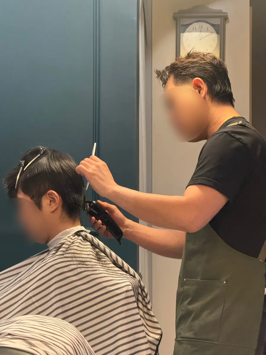 Trimming the back of the head with clippers