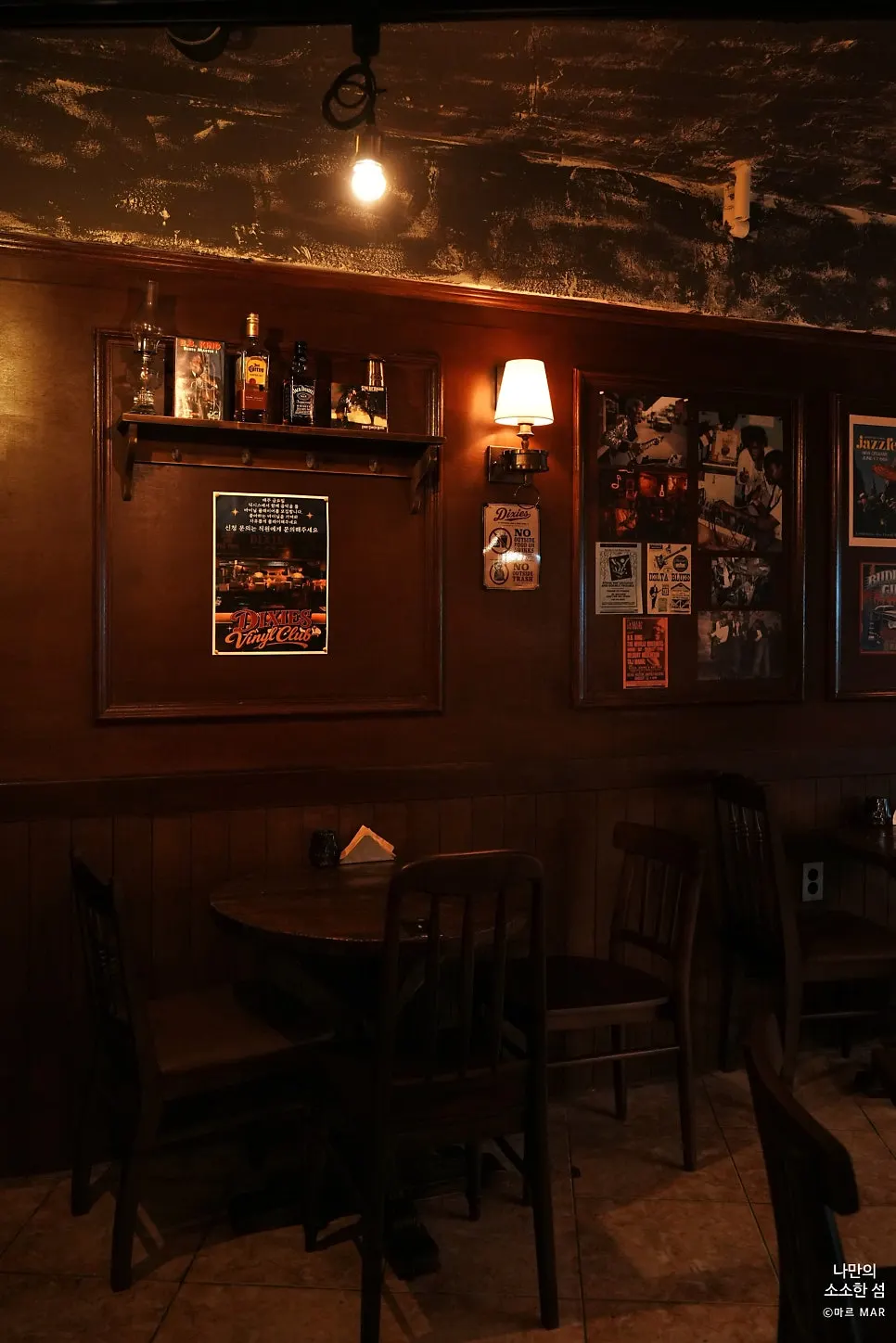 Interior wall at Dixie's covered in vintage American posters