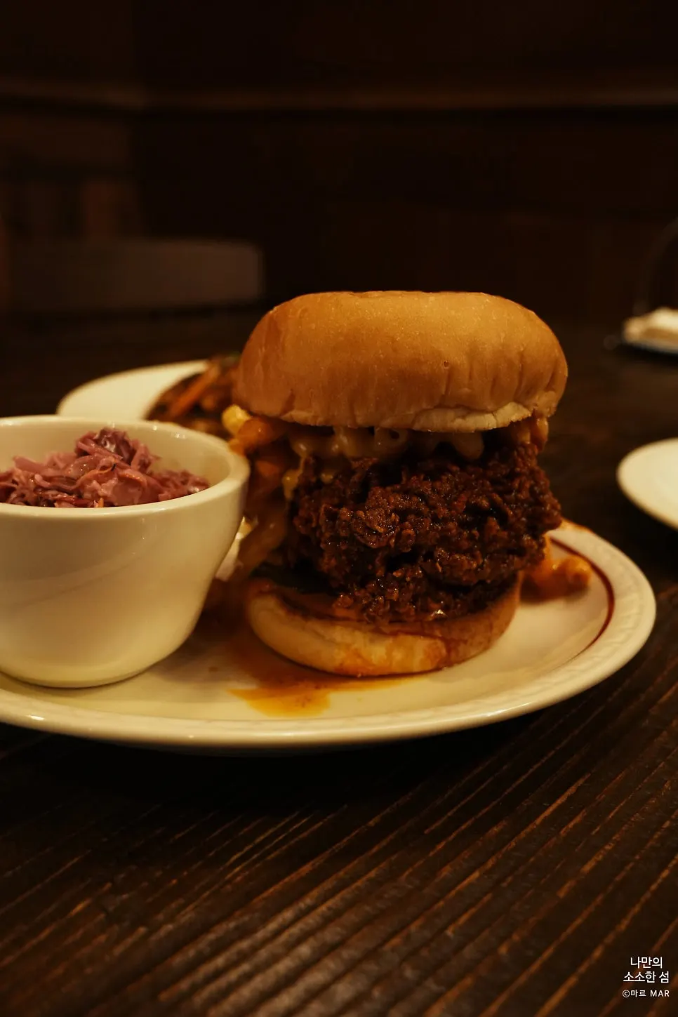 Cross-section of the Nashville hot chicken burger with mac and cheese inside