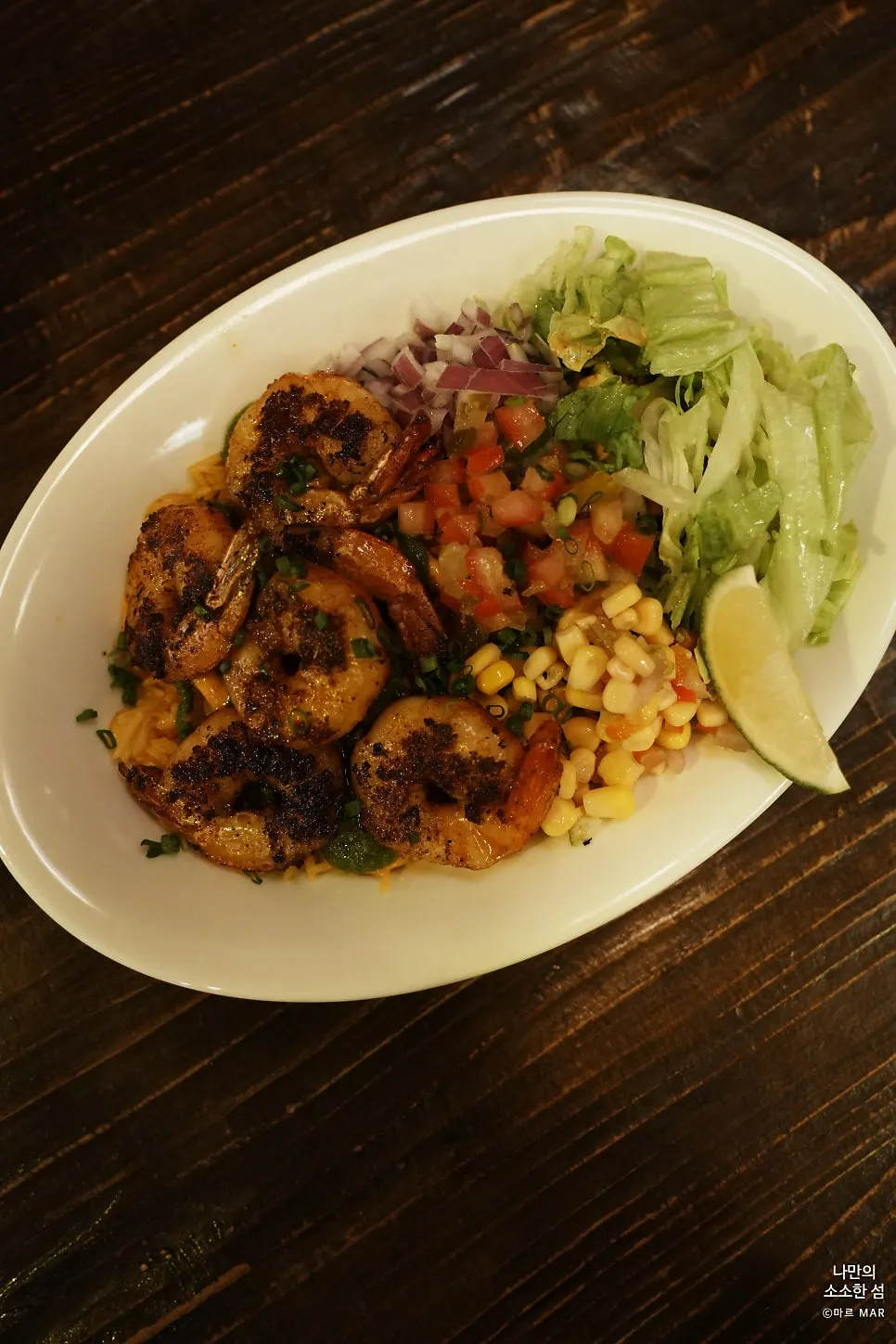Partly eaten Cajun shrimp bowl