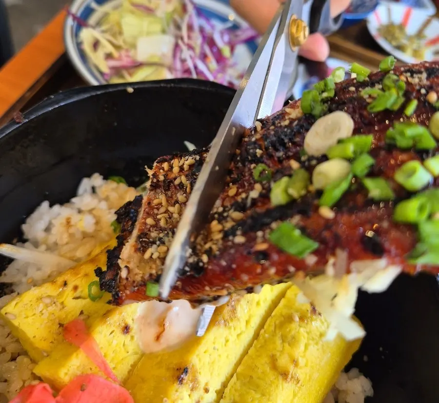 Soft rolled egg omelet with a large piece of eel