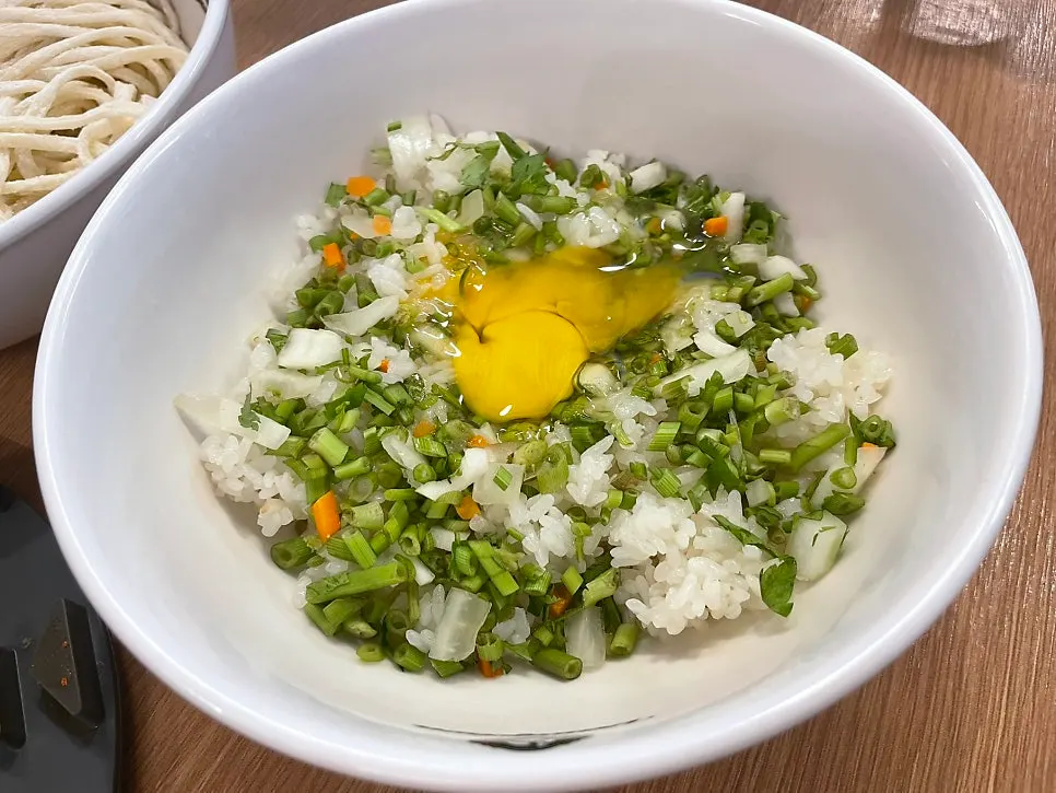 Shabu-shabu pot lined with mushrooms and napa cabbage