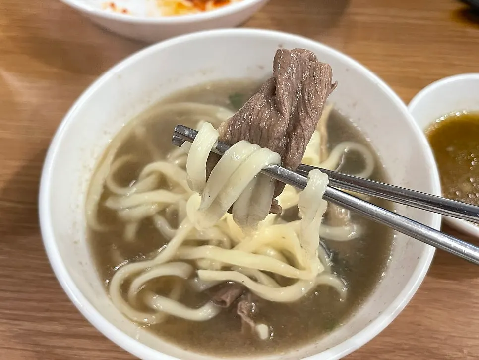 Pot of thick kalguksu noodles cooking