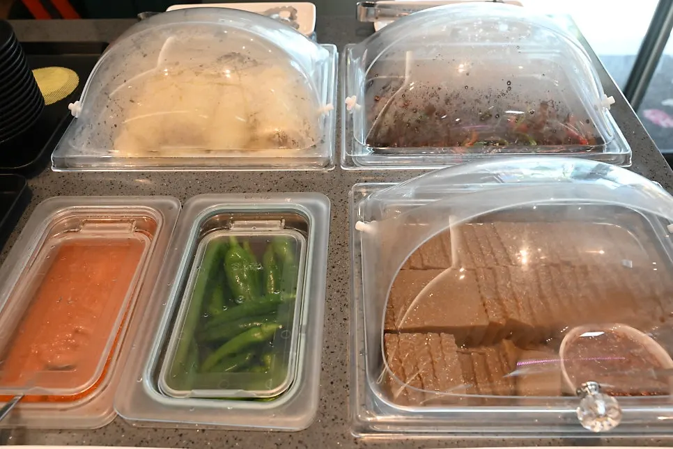Wide table set with side dishes and accompaniments