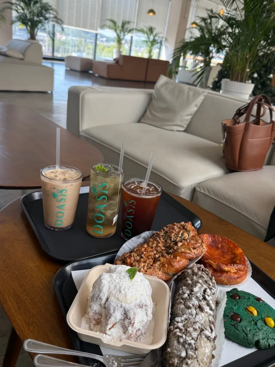 Table setting with bakery items and drinks at Doasis