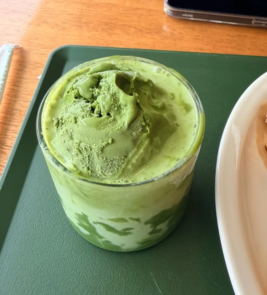 Matcha oreum drink topped with ice cream