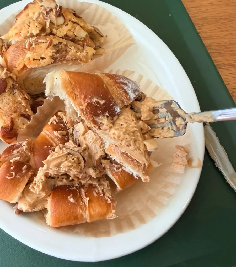 Salt bread sliced and eaten with cream
