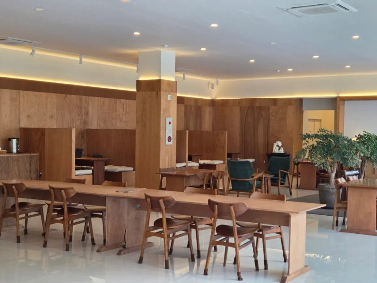 Gallery-like interior hall of Dobana with widely spaced tables