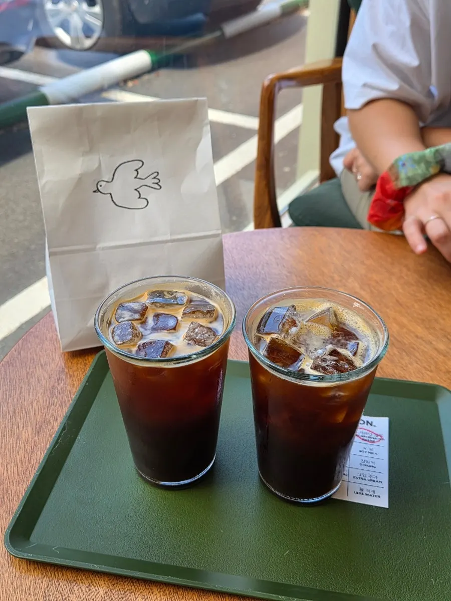 Iced americano placed at a window seat at Dobana