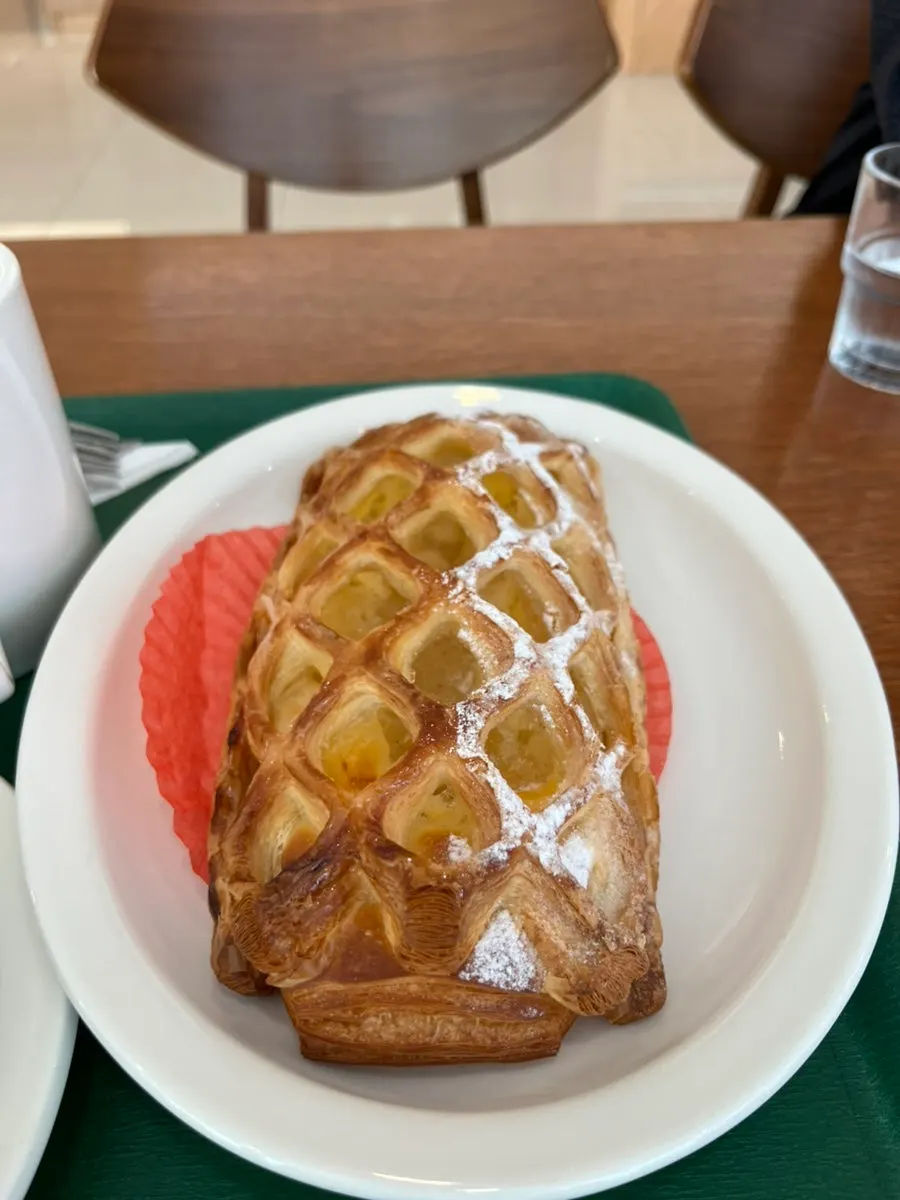 Cross-section of Dobana's apple pastry showing its flaky layers
