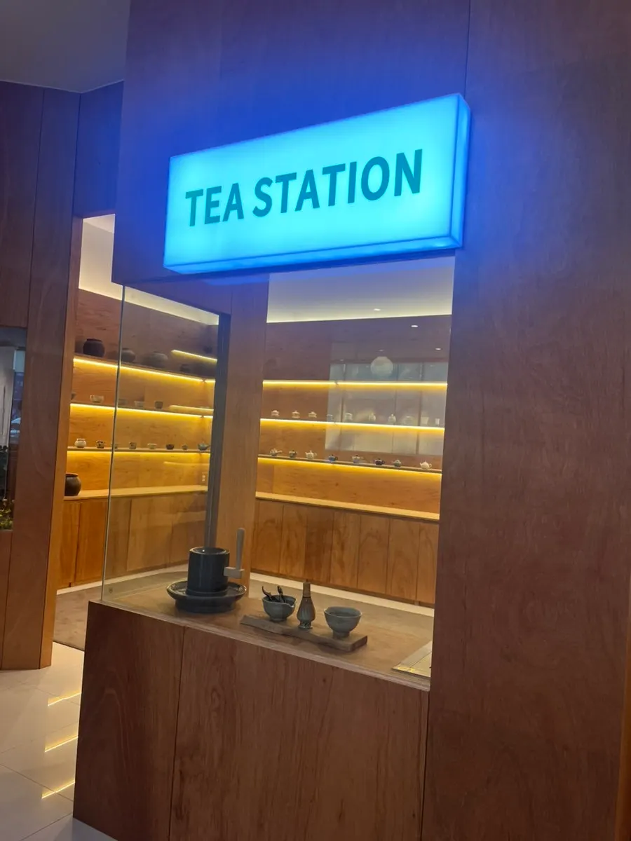 Tea station displaying a variety of tea cups at Dobana