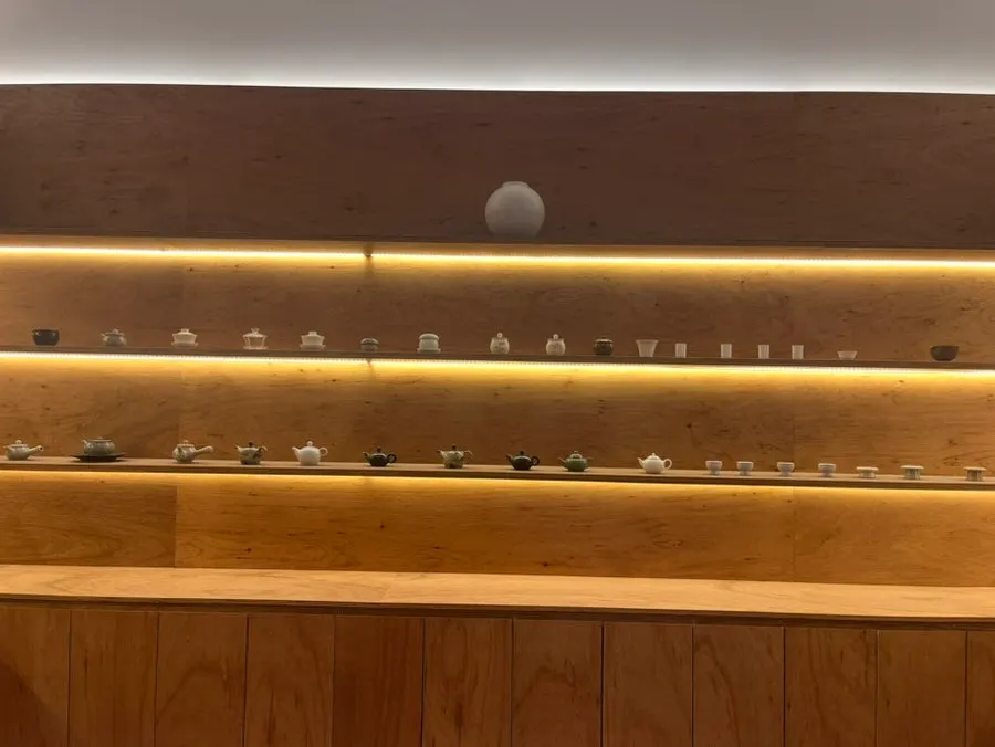 Tea cups on display in the tea station cabinet