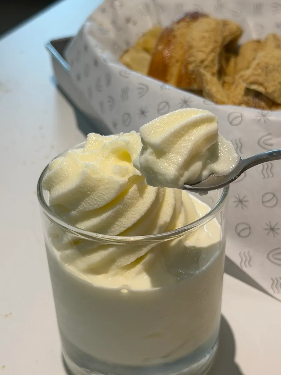 Chimney cake dipped in condensed milk