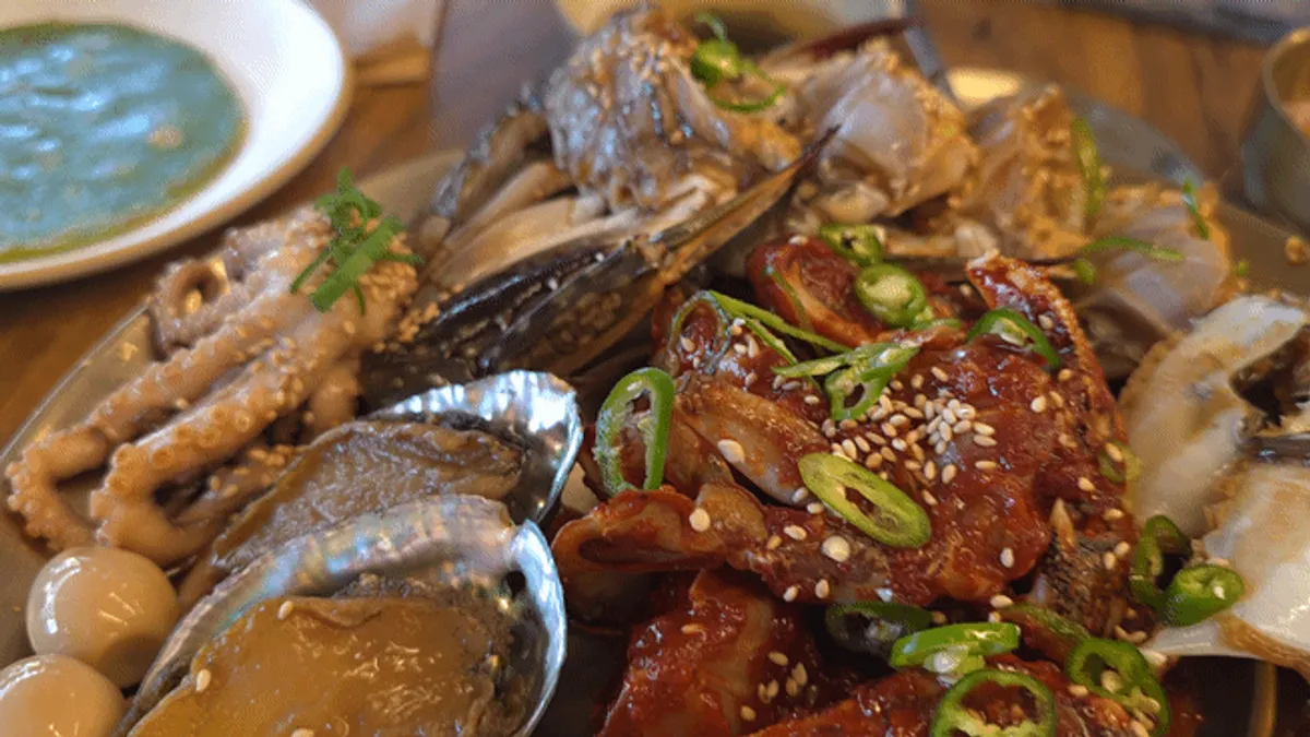Plate of soy-marinated crab and other marinated seafood