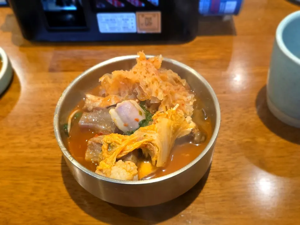 Tripe and broth served in a small plate