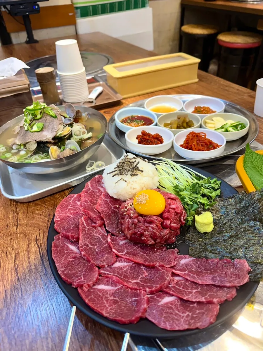 Full table spread of the yuksashimi platter