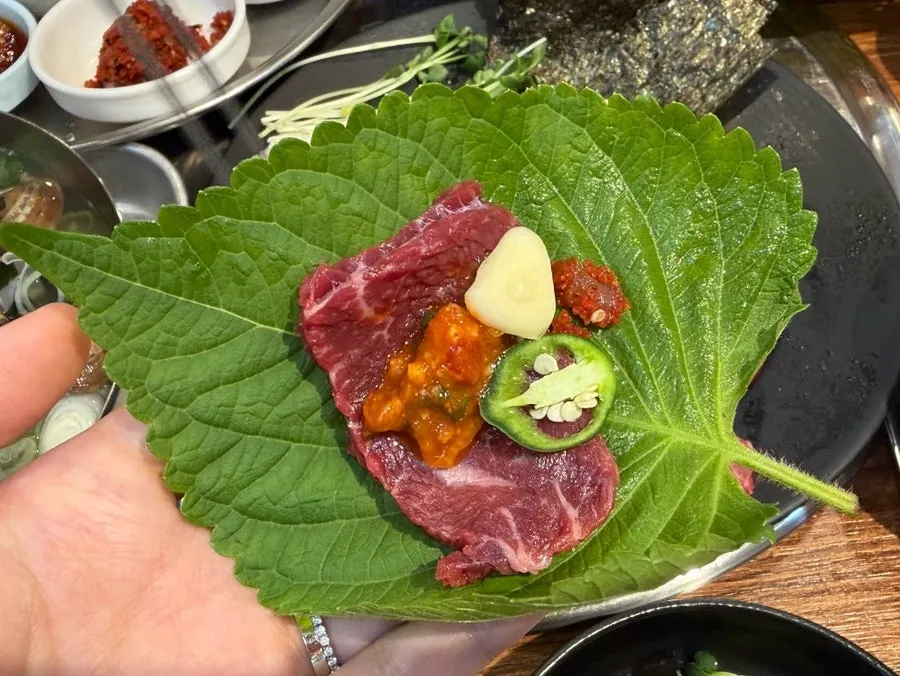 Yuksashimi wrapped in a perilla leaf