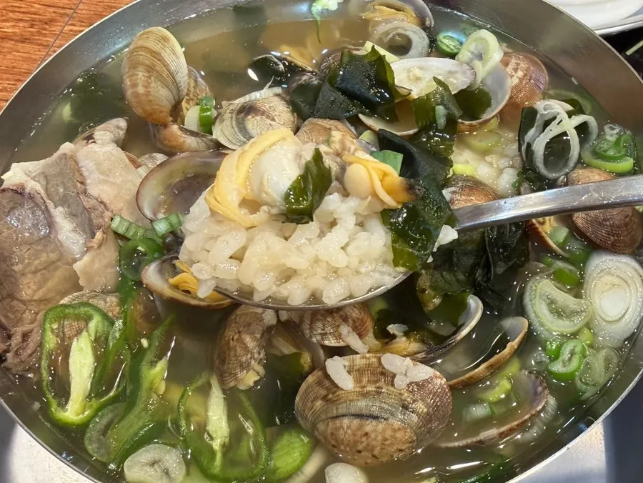 Close-up of the soup showing beef and clams