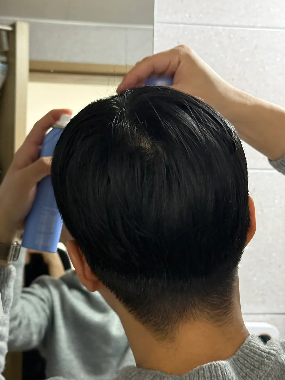 Hair spray for tidying slick-bun flyaways
