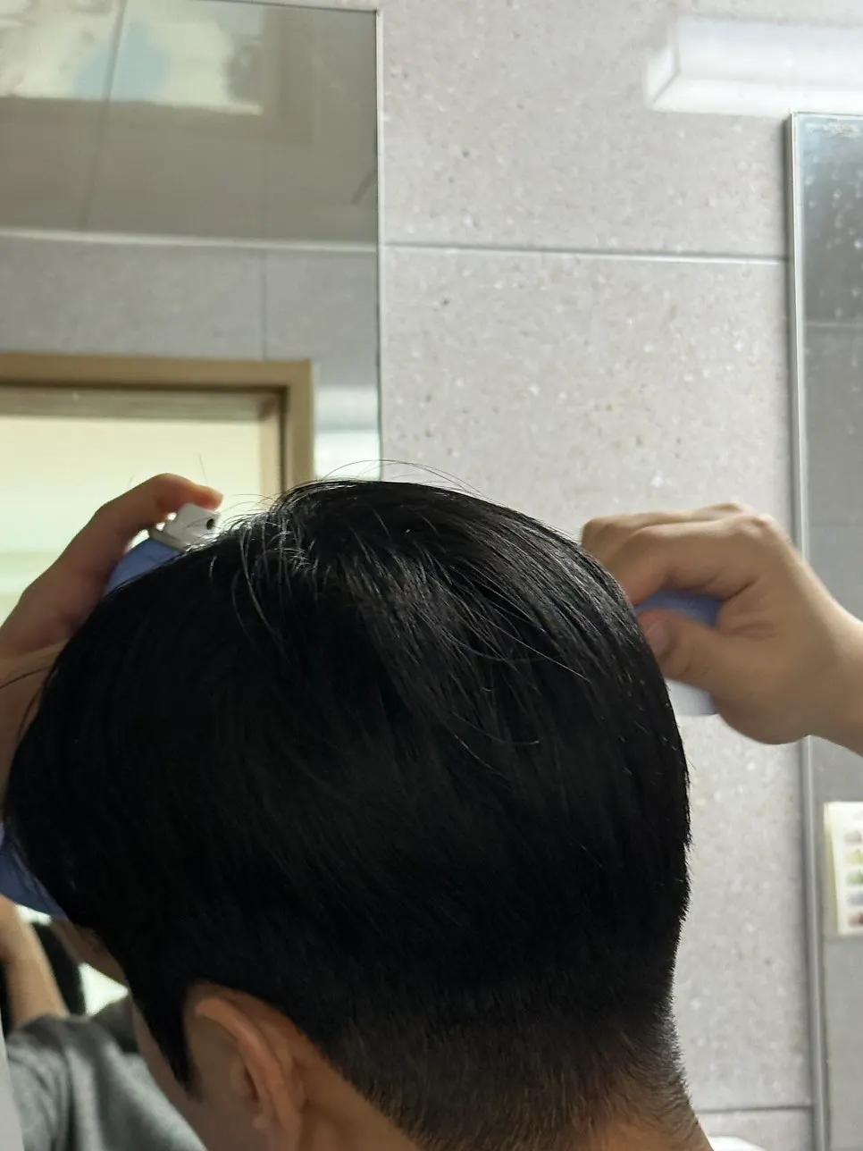 Women’s slick-bun hair-hold styling