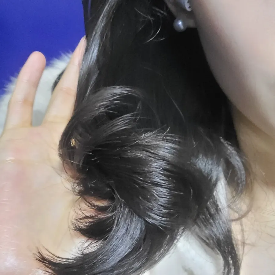 Hair essence dispensed into the hand for use