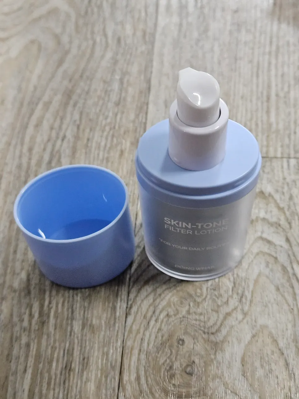 Beige-toned lotion dispensed onto the back of a hand