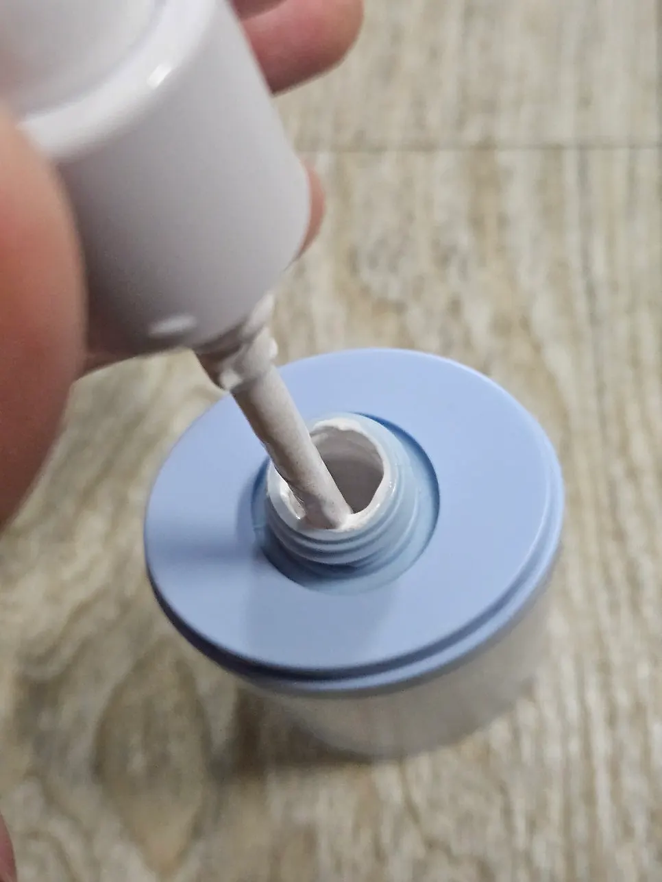 Tone-correcting lotion spread over skin