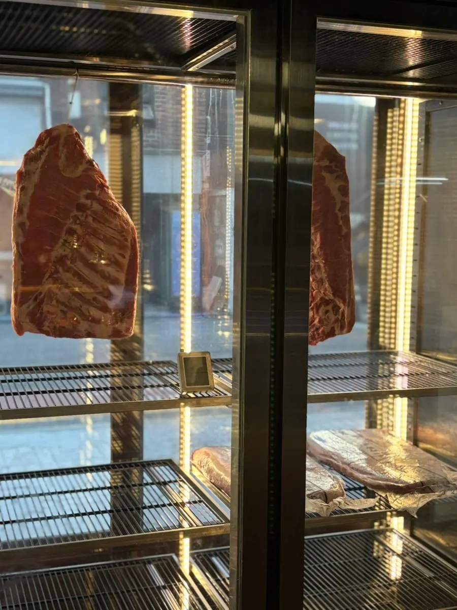 Staff grilling meat for guests at Dojeok Hapjeong