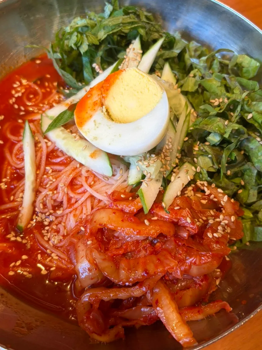 Pork belly placed on top of mul naengmyeon