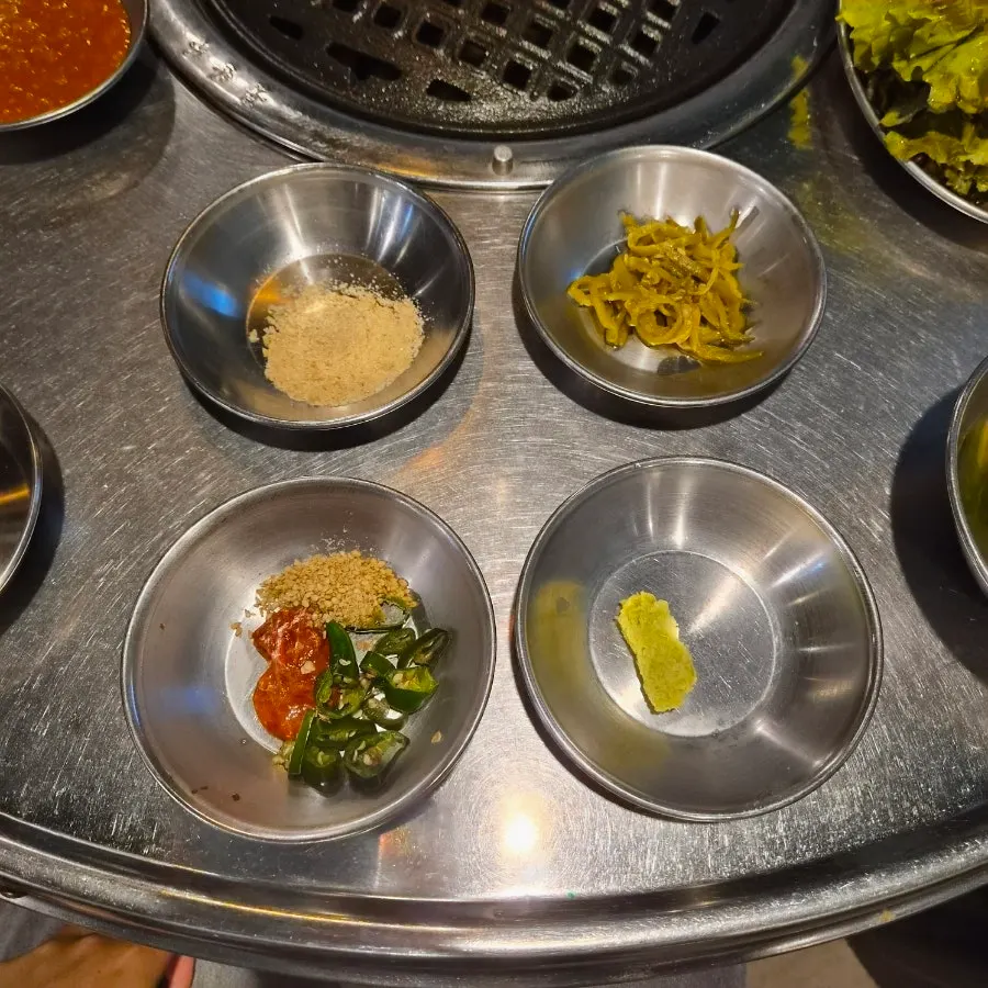 Full table spread of homemade side dishes at the BBQ restaurant
