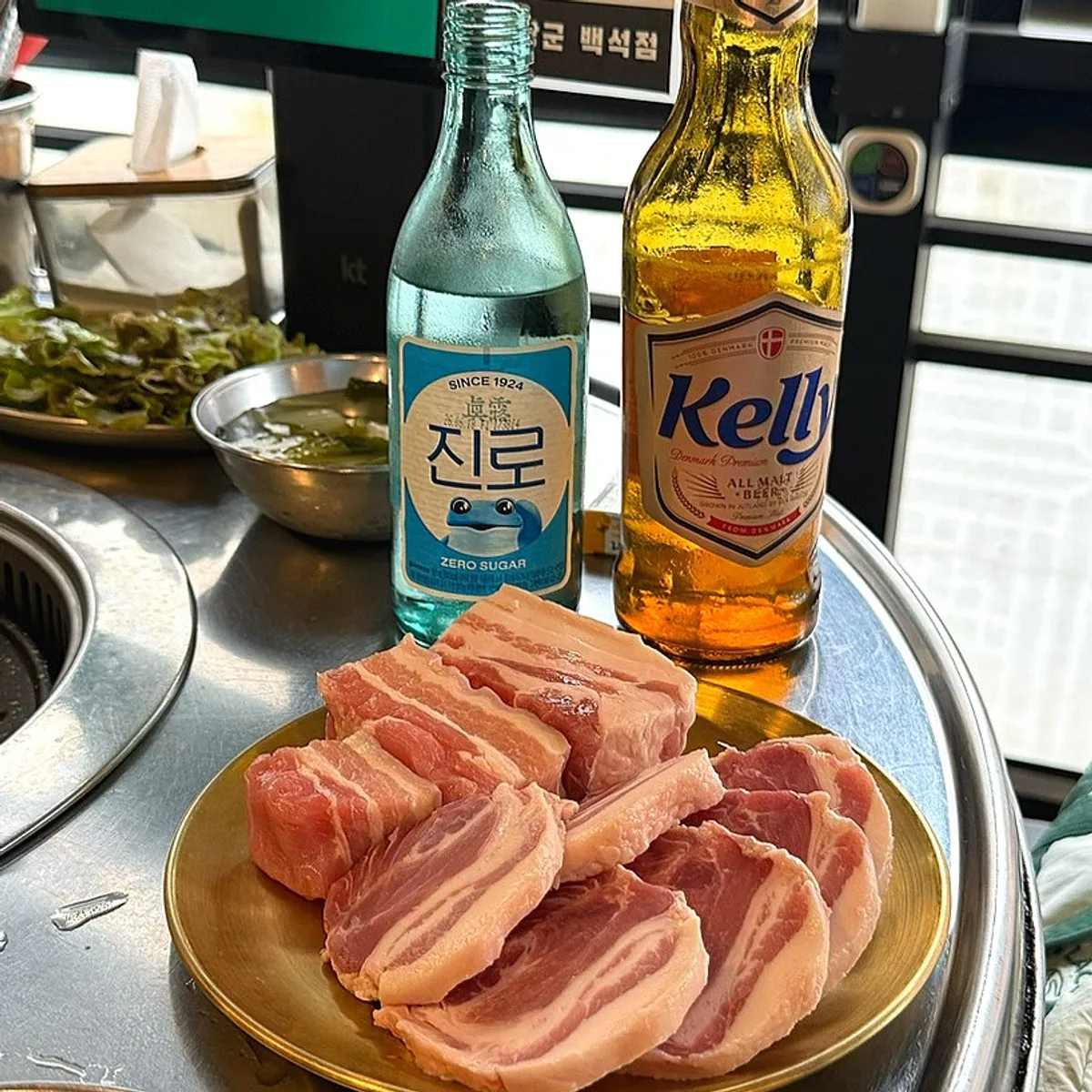 Representative table setting of grilled meat at Dokbul Janggun Ilsan Baekseok Branch