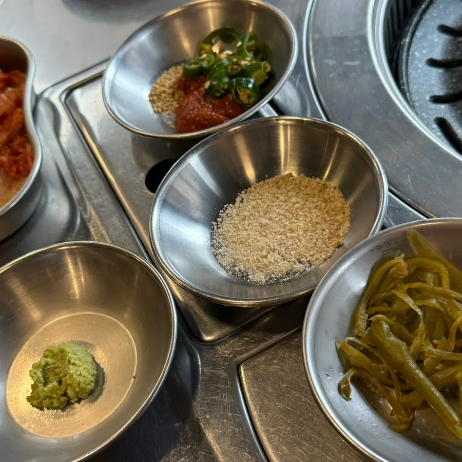 Side dish spread with shredded scallions and pickles